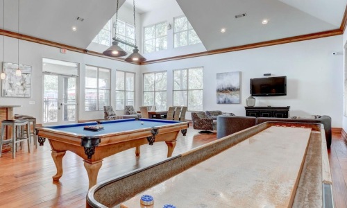 a pool table in a large room