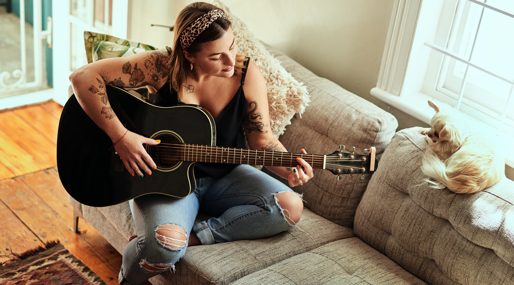 The essence of exceptional living a woman playing a guitar