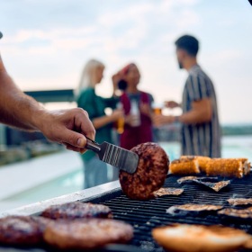 Vibrant community life with a variety of dining options a person cooking food on a grill