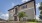 a house with a stone wall