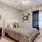a bedroom with a bed and a mirror