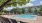a pool with chairs around it